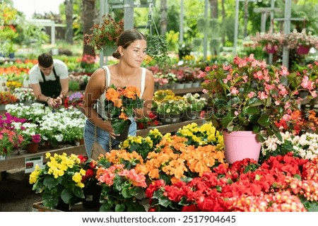 Similar – Foto Bild Nachdenkliche Frau wählt Blumen auf dem Markt aus