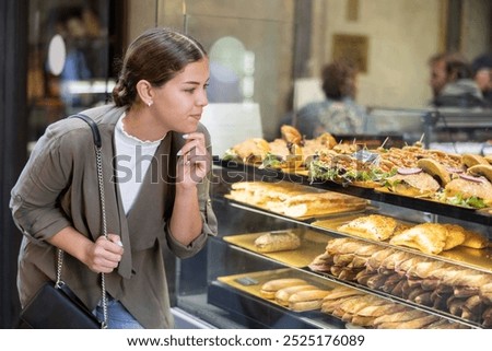 Similar – Image, Stock Photo Curious female on vacation travelling by coastal train