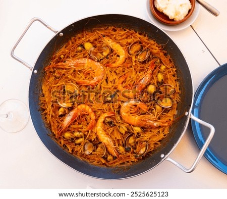 Similar – Image, Stock Photo Pan with tasty fideua dish on table