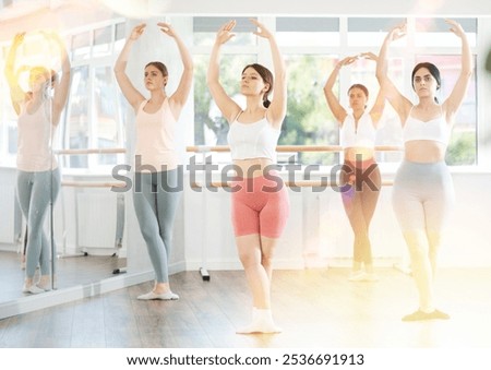 Similar – Image, Stock Photo Concentrated and enthusiastic girl plays table hockey.