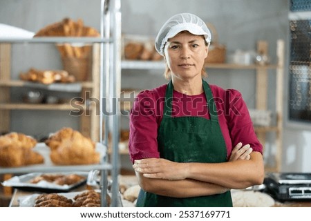 Similar – Image, Stock Photo Cook cutting dough with knife in shape on table