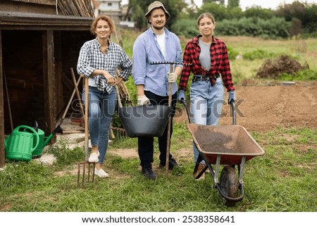 Similar – Image, Stock Photo three wheelbarrows, a rake, a chopper and 2 watering cans are off duty