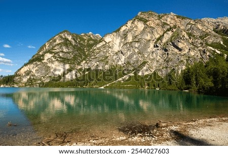 Similar – Foto Bild Von Wasser umgebener steiniger Gipfel in felsigem Tal