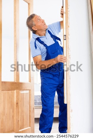 Similar – Image, Stock Photo Aged repairman in professional workshop with tools