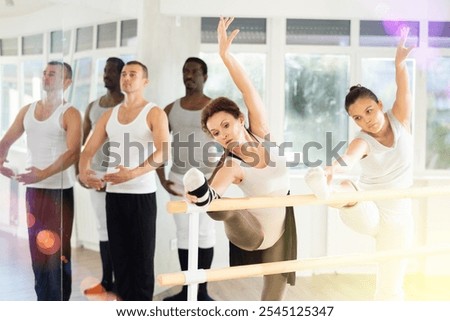 Image, Stock Photo Flexible female dancer doing splits in studio