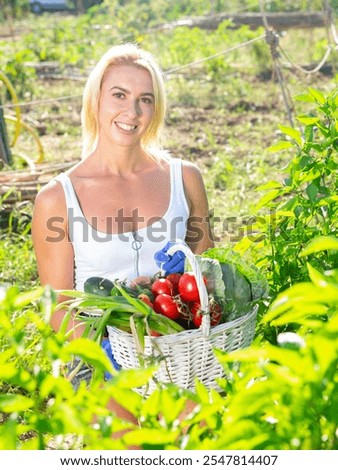 Similar – Image, Stock Photo woman gardener posing with bouquet of astilbe flowers in private garden. Country living and landscape design concept