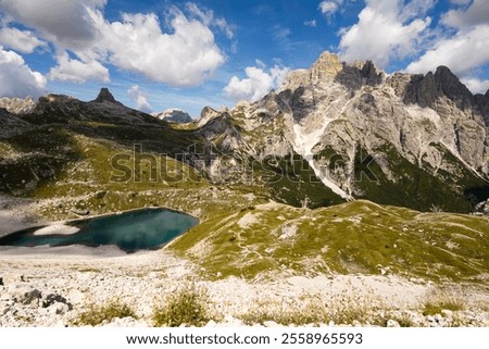 Similar – Foto Bild Von Wasser umgebener steiniger Gipfel in felsigem Tal