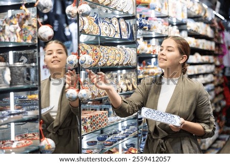 Similar – Image, Stock Photo Curious female on vacation travelling by coastal train