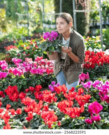 Similar – Foto Bild Weiblicher Kunde wählt Blumen im Gewächshaus