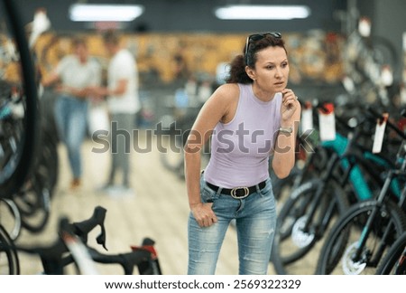 Similar – Image, Stock Photo Cyclist appears on the line from the airfield