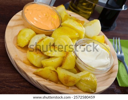 Similar – Image, Stock Photo Patatas bravas traditional Spanish potatoes snack tapas