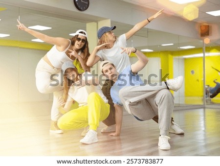 Similar – Image, Stock Photo Flexible female dancer doing splits in studio