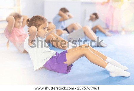 Similar – Image, Stock Photo Confident karate boy doing punch in studio