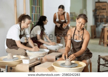 Similar – Image, Stock Photo Glad woman sitting near building wall in city