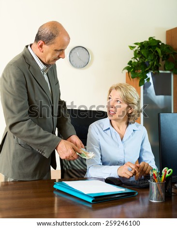 Chief paying to elderly assistant an yearly bonus in office