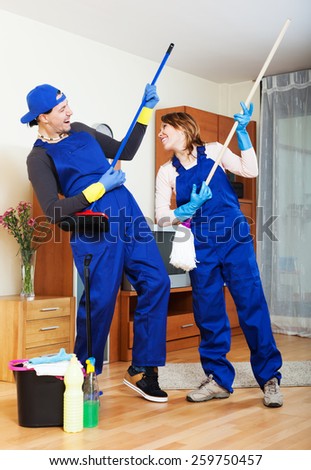 Smiling cleaning team in uniform is ready to work