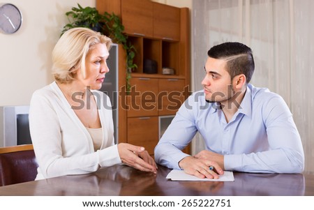 Financial crisis in family of depressed adult son and his senior mature mother