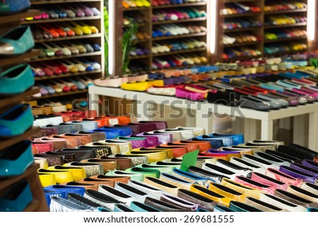 Female shoes diversity at shelves of apparel shop