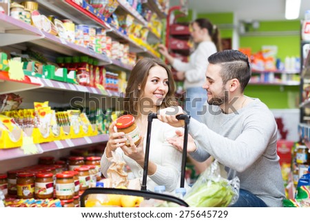 People purchasing a food for week in supermarket