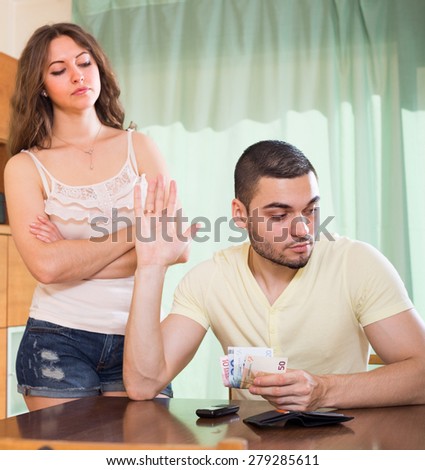 Young married couple having conflict about financial problems