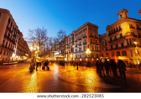 BARCELONA, SPAIN - MARCH 13, 2014: La Rambla in night. Barcelona, Spain. La Rambla one of symbol of city. Located between El Raval and Barri Gotic districts