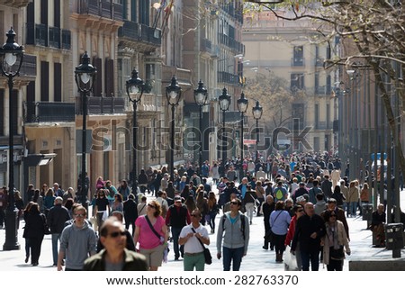 BARCELONA, SPAIN - APRIL  5, 2015: Portal del Angel in spring. Barcelona, Spain. It is pedestrian street in the Ciutat Vella district and shopping area.