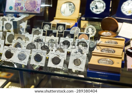 BARCELONA, SPAIN - OCTOBER 28, 2014: Collection of old  coins on counter at numismatics store