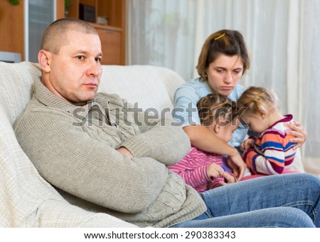 Family with two little children having conflict at home