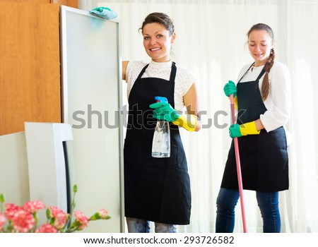 Smiling women workers cleaning company ready to start work