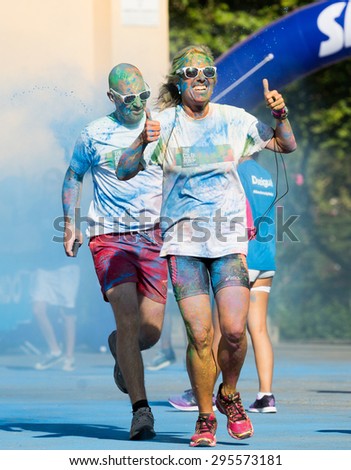 BARCELONA, SPAIN - JUNE 7, 2015: Happy dirty people running at The Color Run, also known as the Happiest 5k on the Planet, is a unique paint race