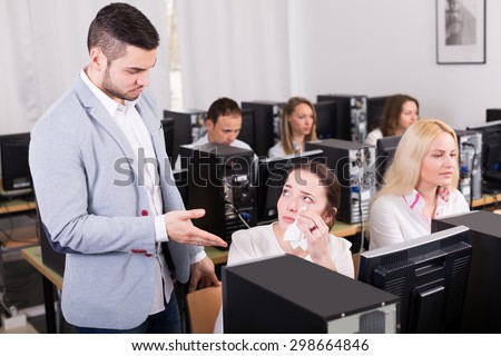 Strict boss and crying european clerk at open space working area