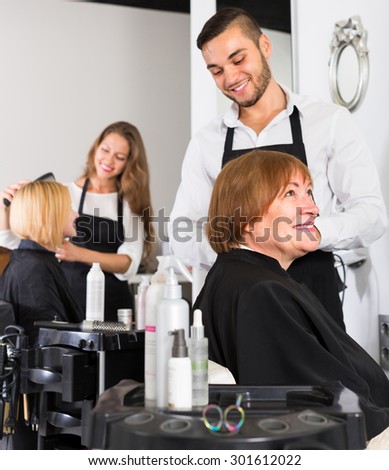 Portrait of happy senior female at the hairdressing salon