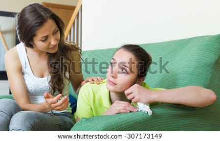 Young european woman calms a crying friend