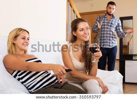 Love triangle: sad husband, smiling wife and lover at home interior
