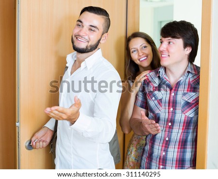 Young family visit  new modern apartment with realtor