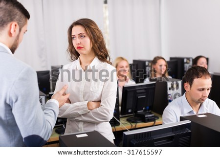Strict boss and crying clerk at open space working area