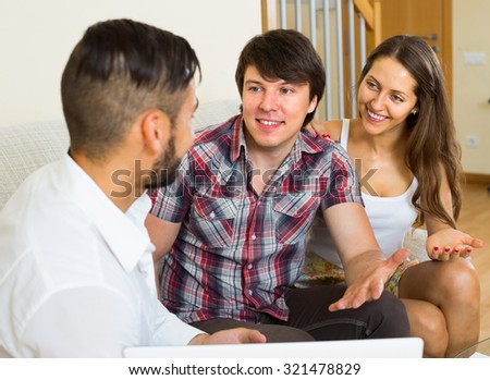 Young happy salesman try hard to sign a contract with customers