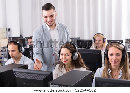 Satisfied supervisor and employees of technical support line