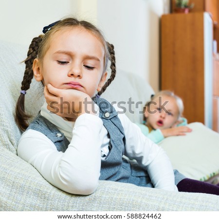Portrait of two little miserable girls having conflict at home Foto stock © 