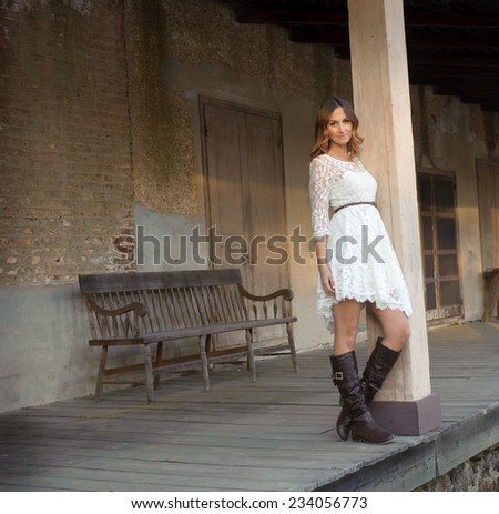 country girl with white dress and boots