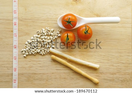 Cherry tomatoes, dried millet and stick biscuit (healthy concept)