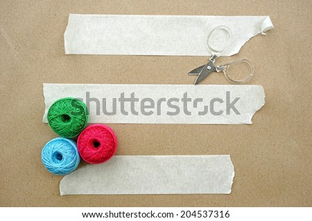 Packaging Materials with Scissors, tape and thread