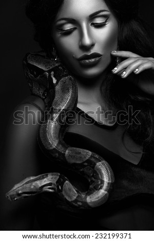 Sexy woman with a snake