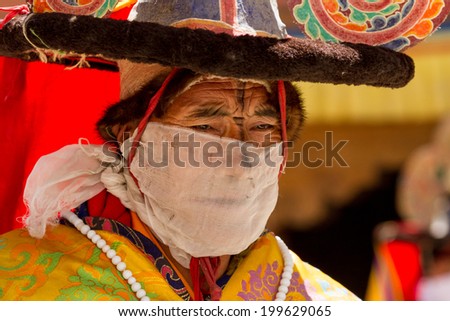 KARSHA, INDIA - JUL 17: A monk performs a religious mask dance during the Cham Dance Festival on Jul 17, 2012 in Karsha, India.