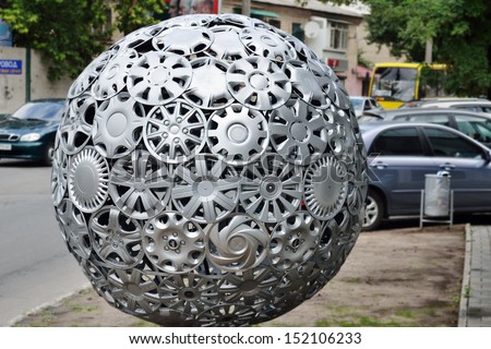 KHERSON, UKRAINE - AUG 27: close view of advertising ball made of hubcaps near tire repair shop of official Hyundai and KIA service station taken on August 27, 2013 in Kherson, Ukraine.