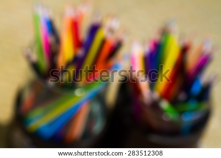 Assortment of colored pencilsColored Drawing PencilsColored drawing pencils in a variety of colors blurred