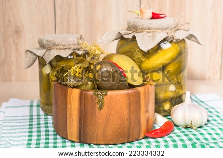 pickled gherkins in jars of home canning