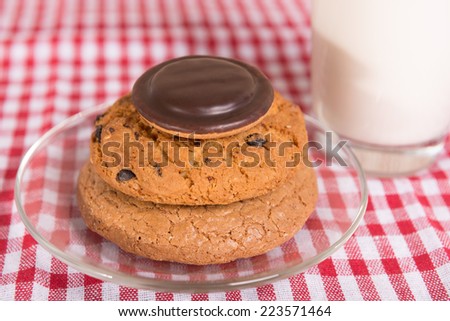 plate of cookies and glass of milk on a napkin