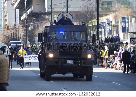 VANCOUVER, BC, CANADA - MARCH 18, 2013 - Armored car rolls resplendently in the annual Saint Patrick\'s Day Parade in Vancouver, Canada.