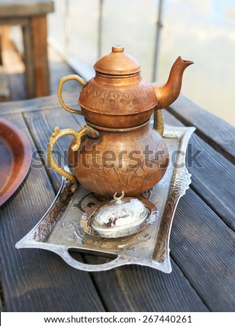 Turkish copper kettles on a wooden table